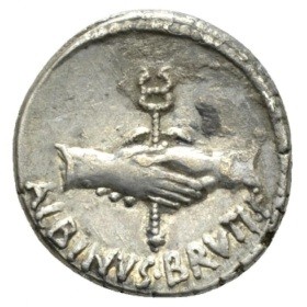 Roman silver coin showing a hand shake in front of a caduceus. Beneath the image is the name Albinus Bruti F in rustic capitals.