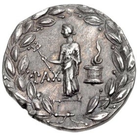 A silver Roman coin showing the Goddess without wings facing three quarters forward, upholding a caduceus in Her right hand. Behind her is a barrel with a large flame above it, and all around the image is a giant laurel. On the lower left side the coin by the Goddess the legend simply says PAX.